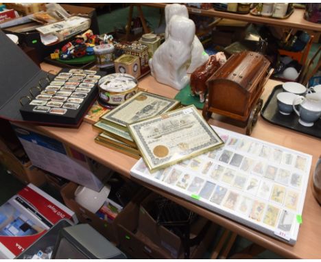 A large quantity of reproduction cigarette cards; tog. with five reproduction framed oil company share certificates