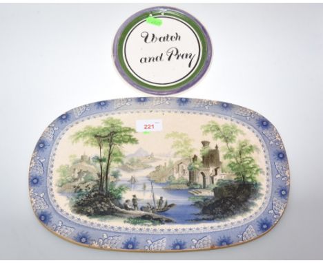 A 19th century Davenport porcelain oval tile transfer printed with figures in a Continetal landscape by a lake and ruins beyo