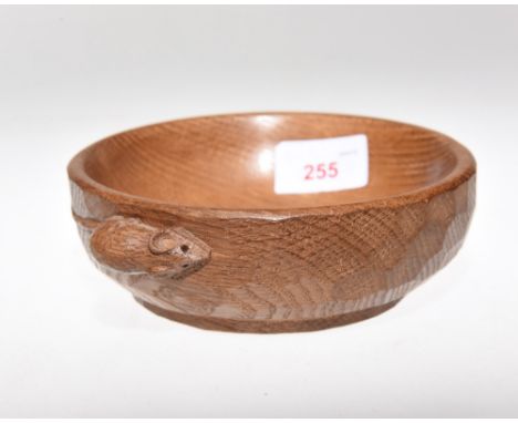 A Robert Mouseman Thompson oak nut bowl, adzed and with carved mouse signature. Diameter 15cm