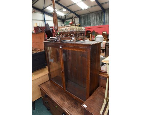 An oak standard lamp, a small late 19th century foot stool with bobbin turned supports and a glazed display cabinet (3)