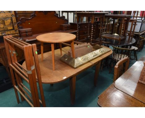 A group of furniture comprising a console table, a folding airer, a coffee table, a 1920s oak table, a brass fender and an oa