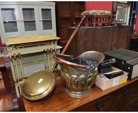 A brass and copper bedwarmer; tog. with a helmet coal scuttle