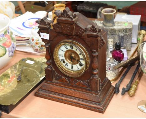 An American mantle clock with an Ansonia movement, the enamel dial with Roman numerals