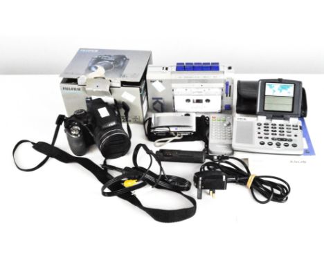A Fujifilm s4400 finepix digital camera, boxed, together with a Philips compact cassette player and other items