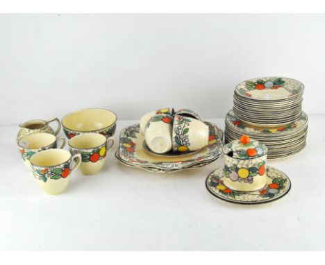 A part Staffordshire 'Pomme D'Or' pattern tea set decorated with colourful fruits including a jam pot, two serving dishes, cu