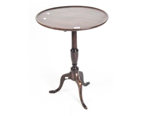 A Georgian mahogany tilt top tripod table with raised lip on turned support, height 72cm x diameter 53cm