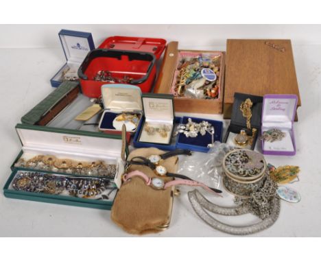 A large quantity of costume jewellery, assorted necklaces, brooches, medals and wrist watches, a Hohner harmonica and other i