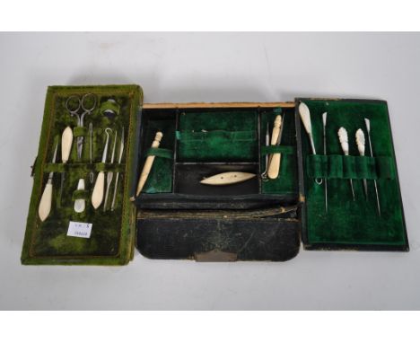 A selection of bone, mother of pearl and ivory sewing implements, including crochet hooks, a spinner, scissors, needles and a