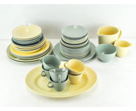 A Woods pottery green ground and pale yellow ground part dinner and tea service including tea cups and saucers, side plates, 