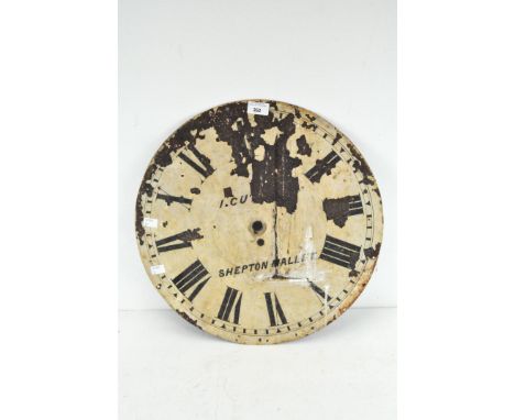 A metal clock dial inscribed I. CUT... and SHEPTON MALLET and with Roman numerals, remains of pale enamel, diameter 46cm