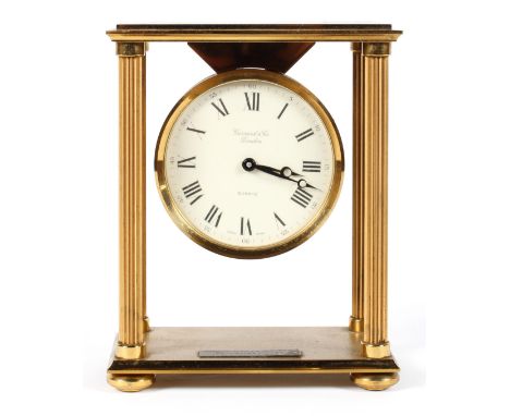 A Garrard &amp; Co gilt brass portico style mantel clock, with a 3 1/4" dial, presentation plaque and quartz movement, 18cm h