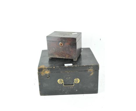 A Victorian stained wood tea caddy, on bun feet, width 15.5cm; together with another wooden box, painted black with a hinged 