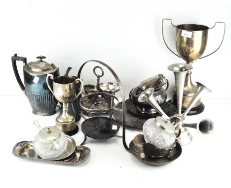 A collection of silver plate, comprising trophies, a coffee pot, napkin rings, trays, jugs and other pieces