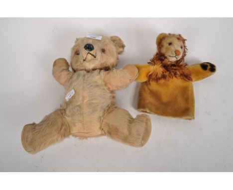 An early 20th century teddy bear, golden mohair, plastic eyes and nose and velvet paws, together with a hand puppet modelled 