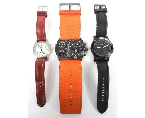 Three modern wristwatches, comprising; Gents Fossil 10-ATM stainless steel cased on rubber strap, Nautica type N-MX62 and a L