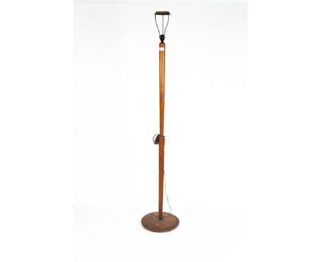 A mid-century standard lamp with tapering support and round base, height to fitting 154cm