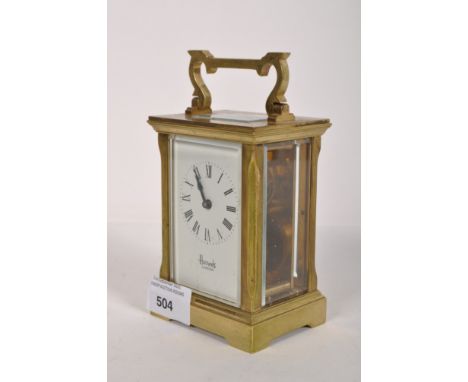 A Harrods brass cased carriage clock