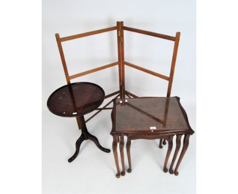 A nest of three walnut occasional tables, together a pine folding towel rail and a mahogany wine table in the Georgian style 