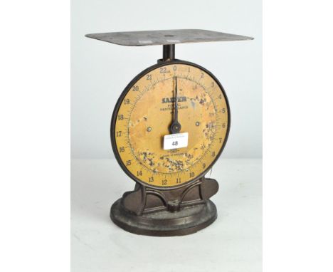 A set of Salter postal scales, No.25, orange dial within a cast metal frame, height 27cm