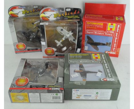 Three Corgi Warbirds 1:72 scale model planes : Hawker Typhoon MK., WB99628, a Messerschmitt, WB99629 and a Focke Wulf 190, WB