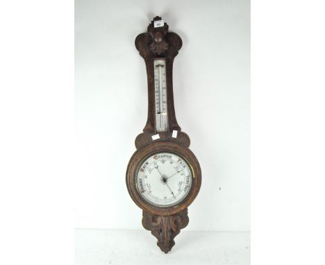 A early 20th Century oak cased banjo aneroid barometer, with thermometer to stem, height 87cm