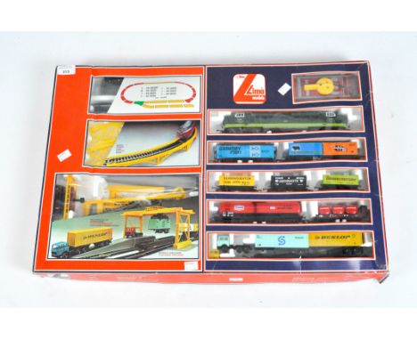 A boxed Lima train set including bridge container unloader, carriages and battery control