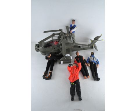 An Action Man in a 2011 HM Armed Forces helicopter, together with 5 Action Men including 'Snake Eyes' and one in karate unifo