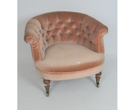 A late 19th/early 20th century button back upholstered armchair, 60cm high