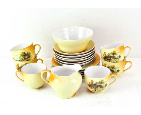 A Victoria China Czechoslovakia part tea set, with transfer printed decoration of a cottage scene on a yellow and orange grou