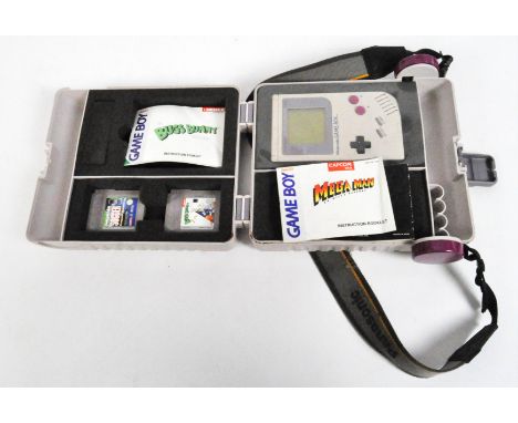 An original Nintendo Game Boy with Bugs Bunny and Soccer games, with instruction manual, in carry case