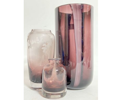 Three amethyst glass purple vases comprising a large cylindrical vase (h- 25.5cm), a Scottish art glass engraved/etched Caith