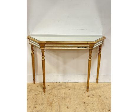 A modern giltwood mirror top and frieze console table raised on turmed tapered supports (h. x 83cm l. x 110cm w. x 38)