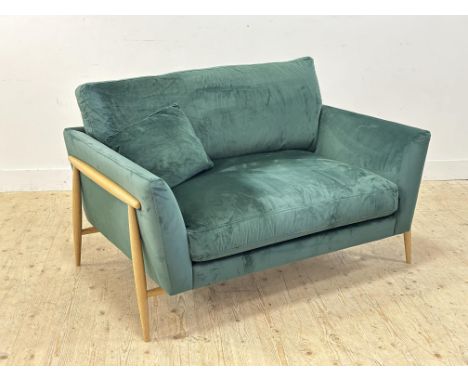 A modern Ercol oak frame two seater sofa in forrest green pile fabric (h.90cm x l.136cm x w.89cm)