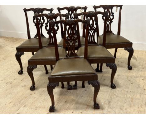 An Edwardian set of six well carved Chippendale style dining chairs with slip in seats in sage leatheron carved suports and p
