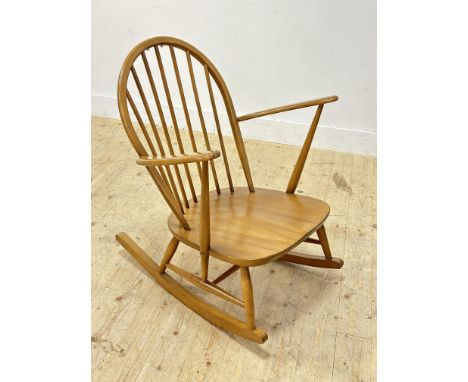 An Ercol stained ash and elm open arm rocking chair (h.85cm)