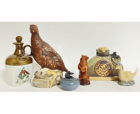 A group of various ceramic liquor bottles comprising a Royal Doulton 'Famous Grouse' Scotch Whisky bottle (marked verso, h- 2