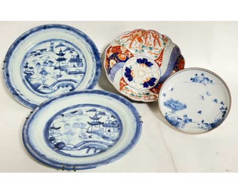 A mixed group of Chinese and Japanese ceramics comprising a pair of Chinese blue and white porcelain dishes each decorated wi
