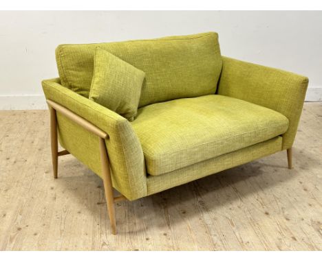 A modern Ercol oak frame two seater sofa in green linen style fabric (h.90cm x l.136cm x w.89cm)