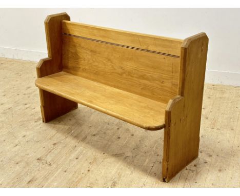 An Edwardian pine kitchen bench with shaped sides (h.87cm x l.127cm x w.46cm)
