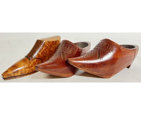 A burr wood carved snuff box or container in the form of a shoe (l- 12.5cm), together with a pair of continental carved treen