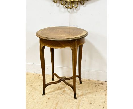 A early 20thc continental parquetry top lamp table with crosbanded border, scalloped frieze, swept our tapered supports with 