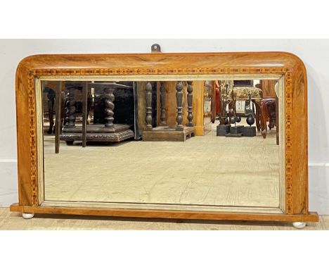 A Victorian walnut and Tunbridge ware style inlaid over-mantle mirror raised on ceramic bun supports (h- 50cm, w- 84cm)