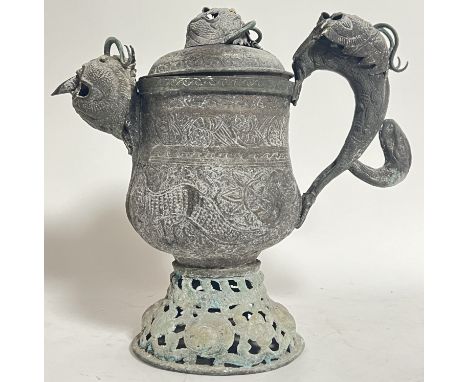 An unusual nineteenth century Tibetan turquoise inlaid copper and wrought metal teapot/kettle with internal pipe, modelled wi