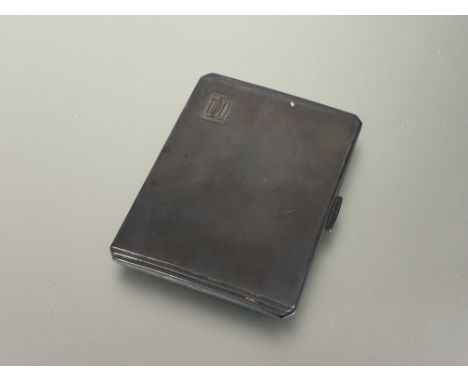 A Birmingham silver engine turned cigarette case engraved with initials T. D.D.L and inner inscription&nbsp; " From ADL 21st 