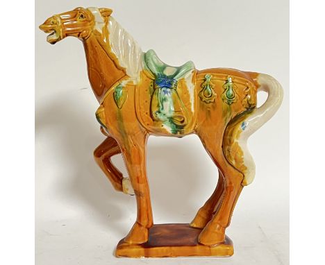 A Chinese Tang-style sancai ornamental ceramic figure of a horse (impressed marks verso, h- 34cm, w- 31cm)