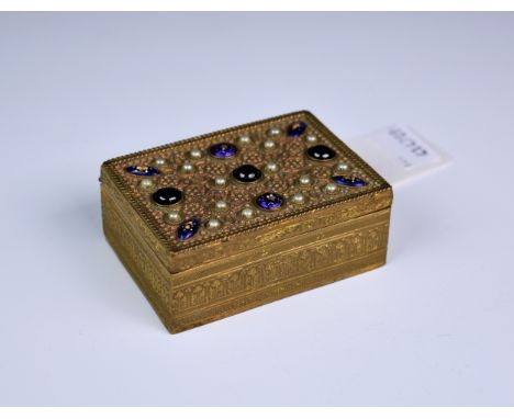 A Continental gilt metal trinket box, c.1900, of rectangular form, the hinged lid inset with semi-precious stones, pearls and