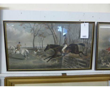 A pair of framed hunting prints.