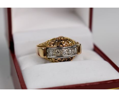 A French 1940s 18ct gold and diamond cocktail ring, the domed and pierced ring with a central white gold band set with five o