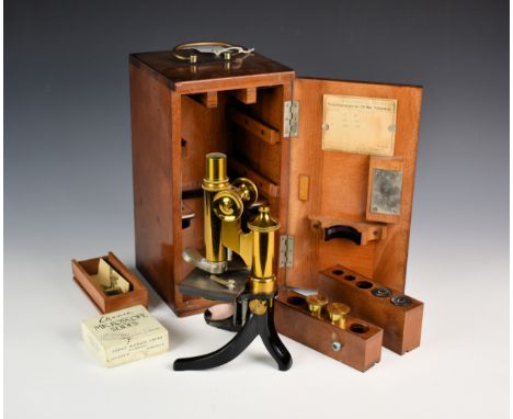 A mahogany cased lacquered brass microscope by E. Leitz, c.1898, the black enamelled and brass instrument no. 44674, with rac