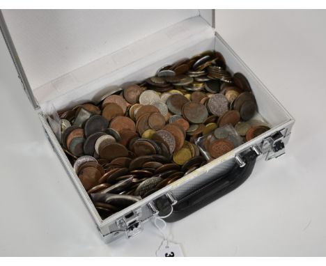 A large quantity of various vintage coins, contained in metal storage case.